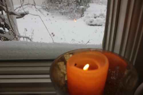 candles in a snowy window